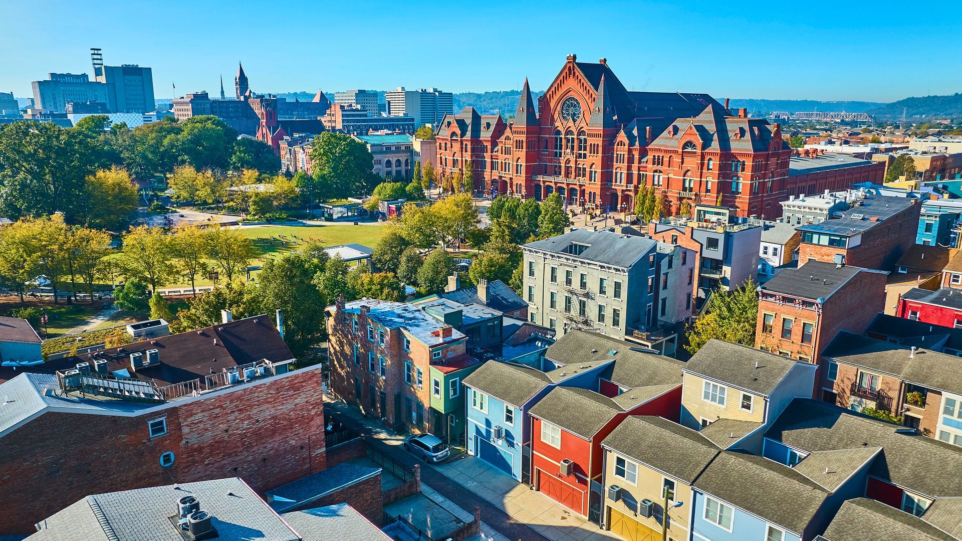 An aerial view of a city with lots of buildings and trees