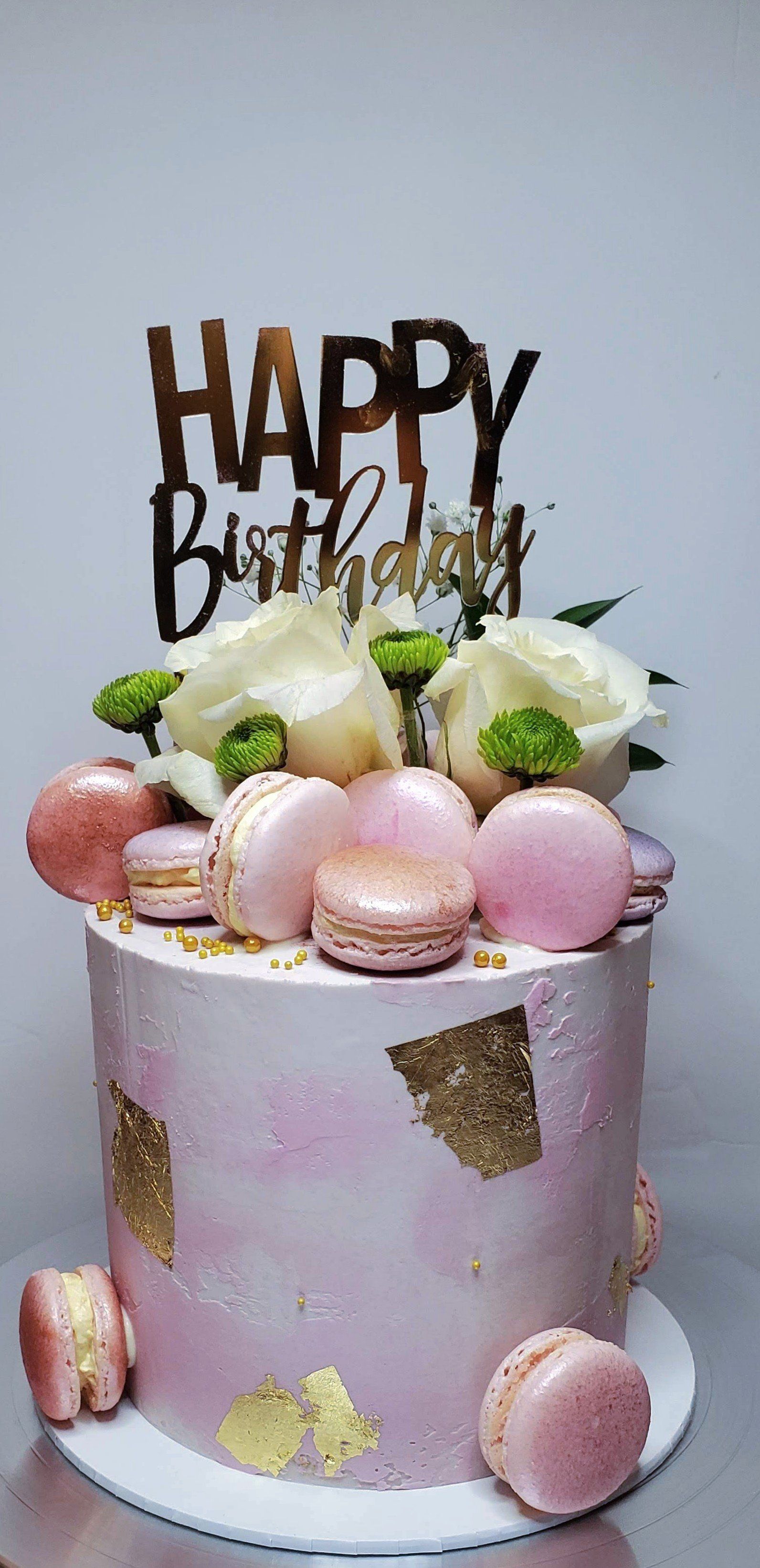 elegant purple cake with macarons and florals
