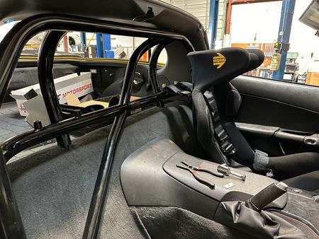 The Inside of a Race Car with a Seat and a Cage | Concord Auto Service Center