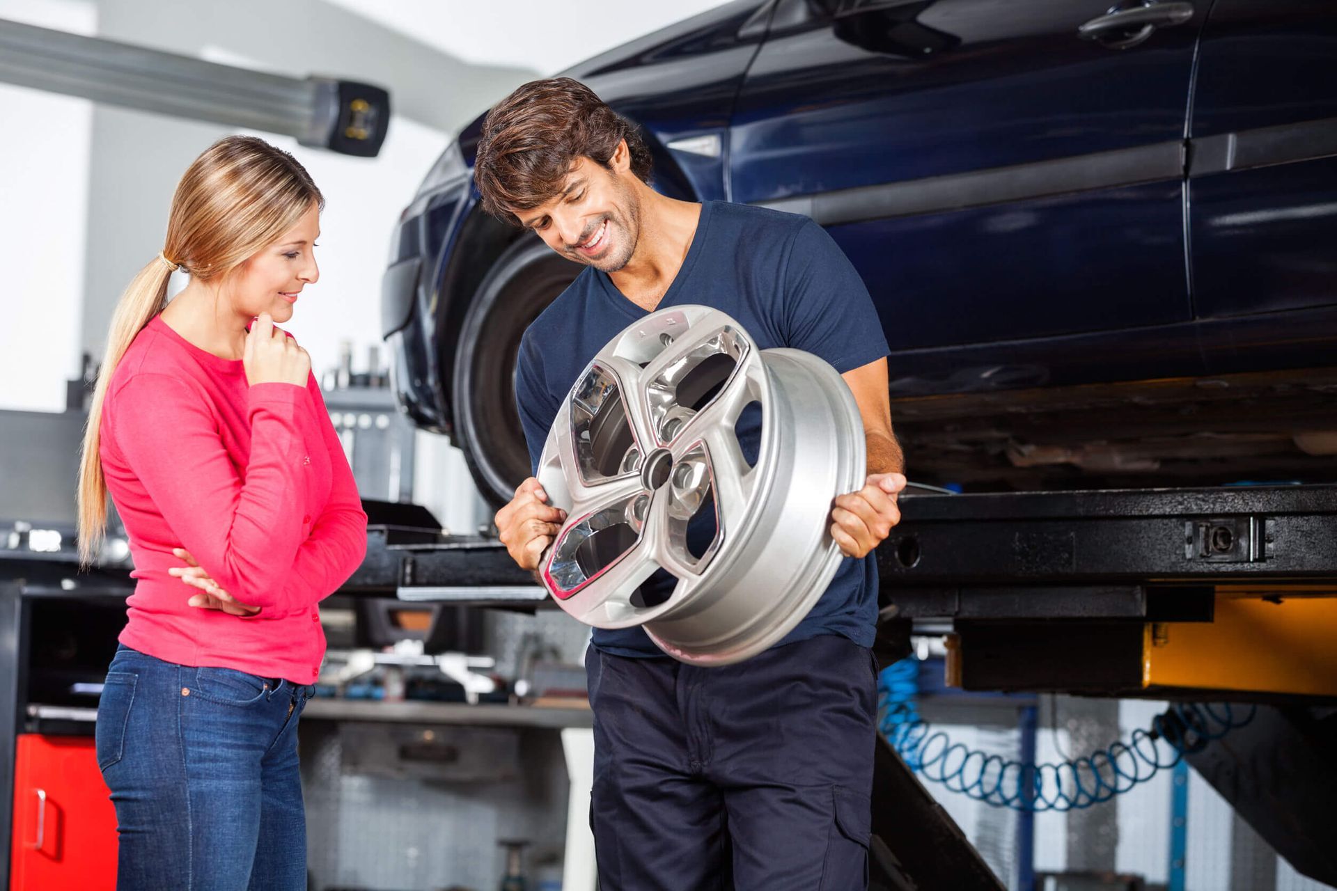 A mechanic explaining a repair to a client