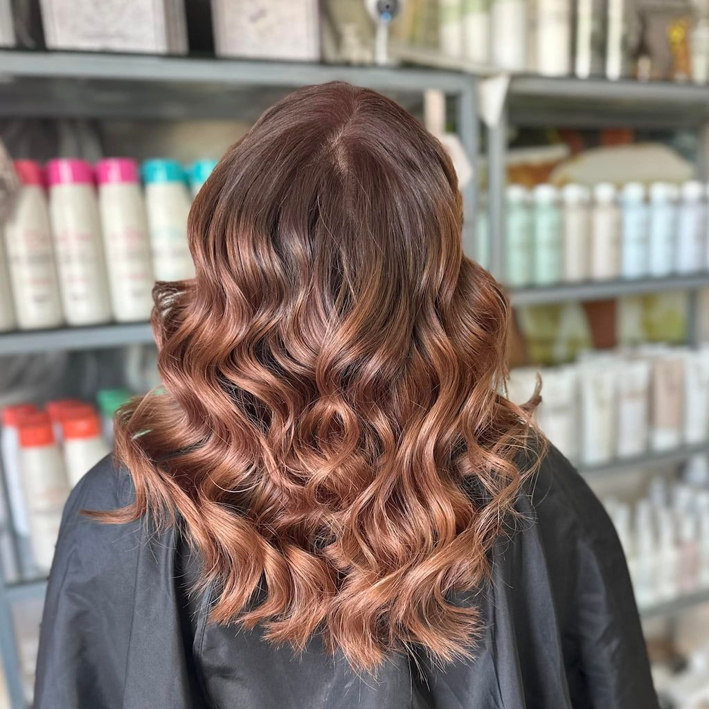 A Woman Has Had Her Hair Dyed In A Salon —  L'Auranda Hair Salon In  Evan St. Mackay, QLD
