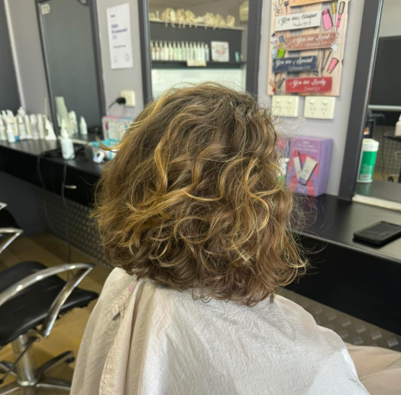 A Woman Has Had Her Hair Done By A Hairdresser —  L'Auranda Hair Salon In Evan St. Mackay, QLD