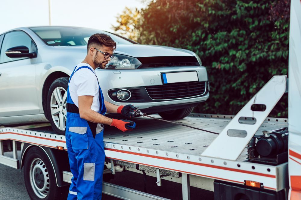 Man Working in Towing Service on the Road — Trade & General Towing in Sandgate, NSW