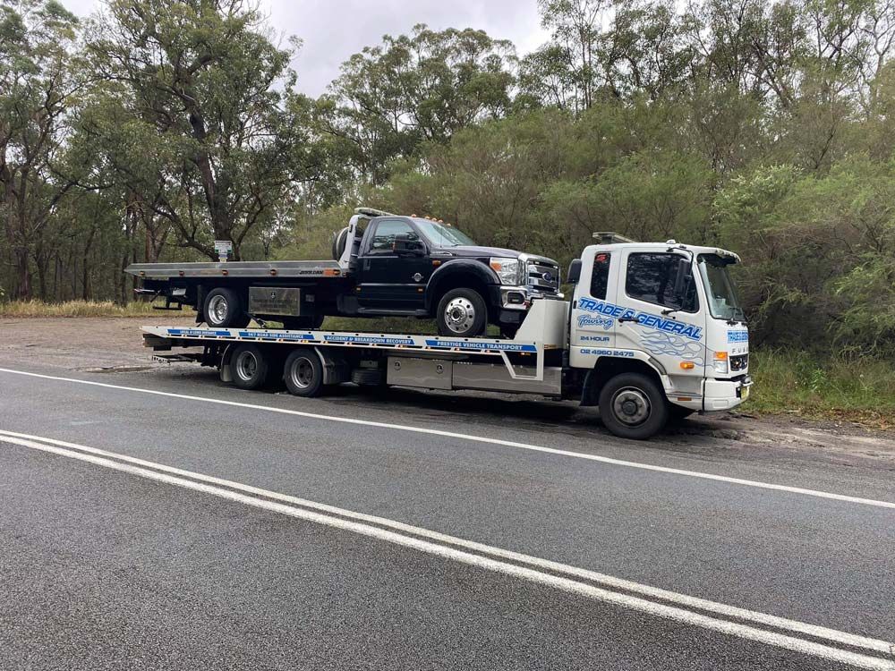 Black Ford F 550 Towed — Trade & General Towing in Beresfield, NSW