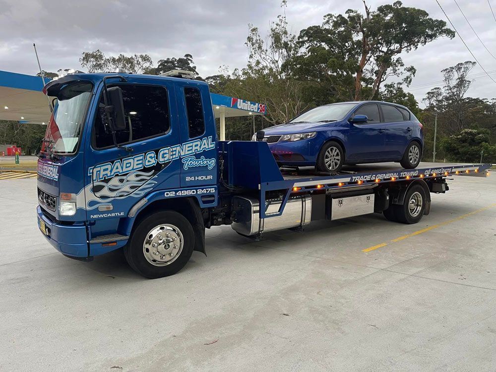 Blue Kia Cerato Towed — Trade & General Towing in Maitland, NSW