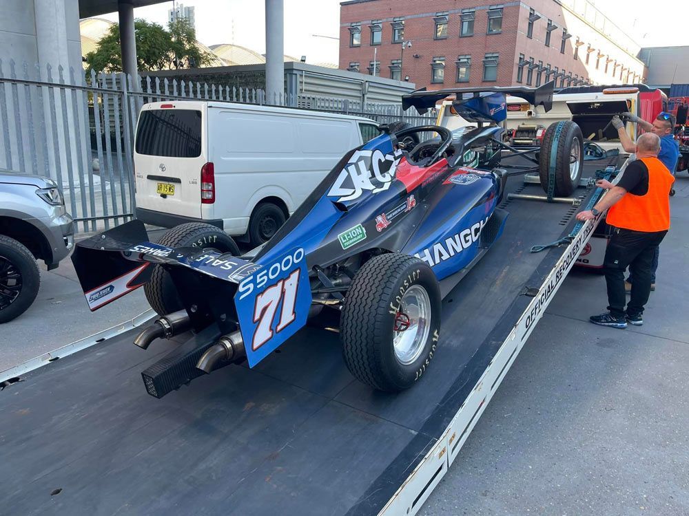Blue Panoz DP01 Racing Car Towed — Trade & General Towing in Lambton, NSW