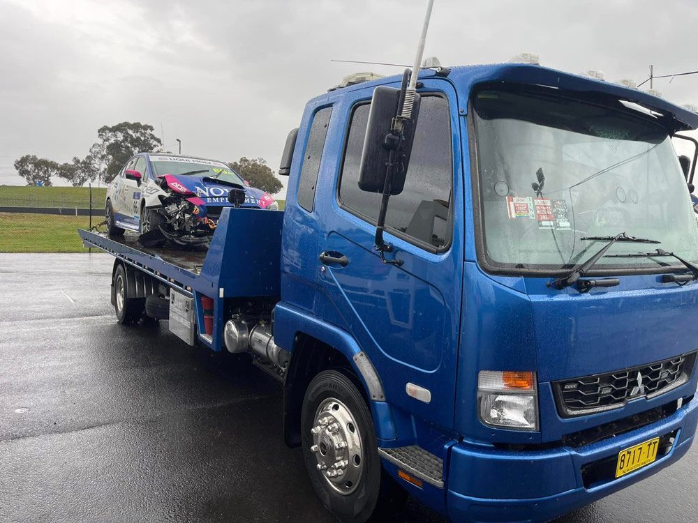 Broken Racing Car Accident — Trade & General Towing in Beresfield, NSW
