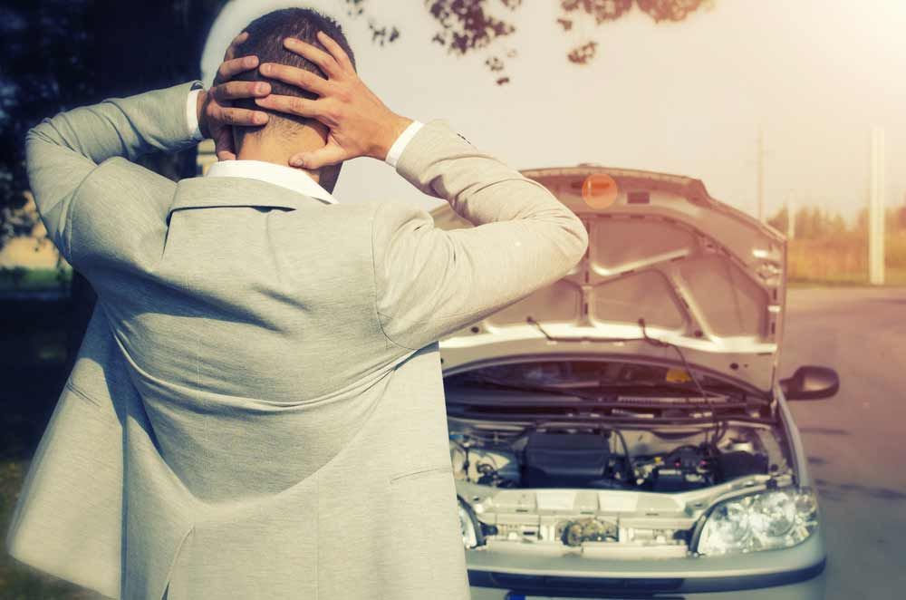 Man Looking At The Broken Car — Trade & General Towing in Sandgate, NSW