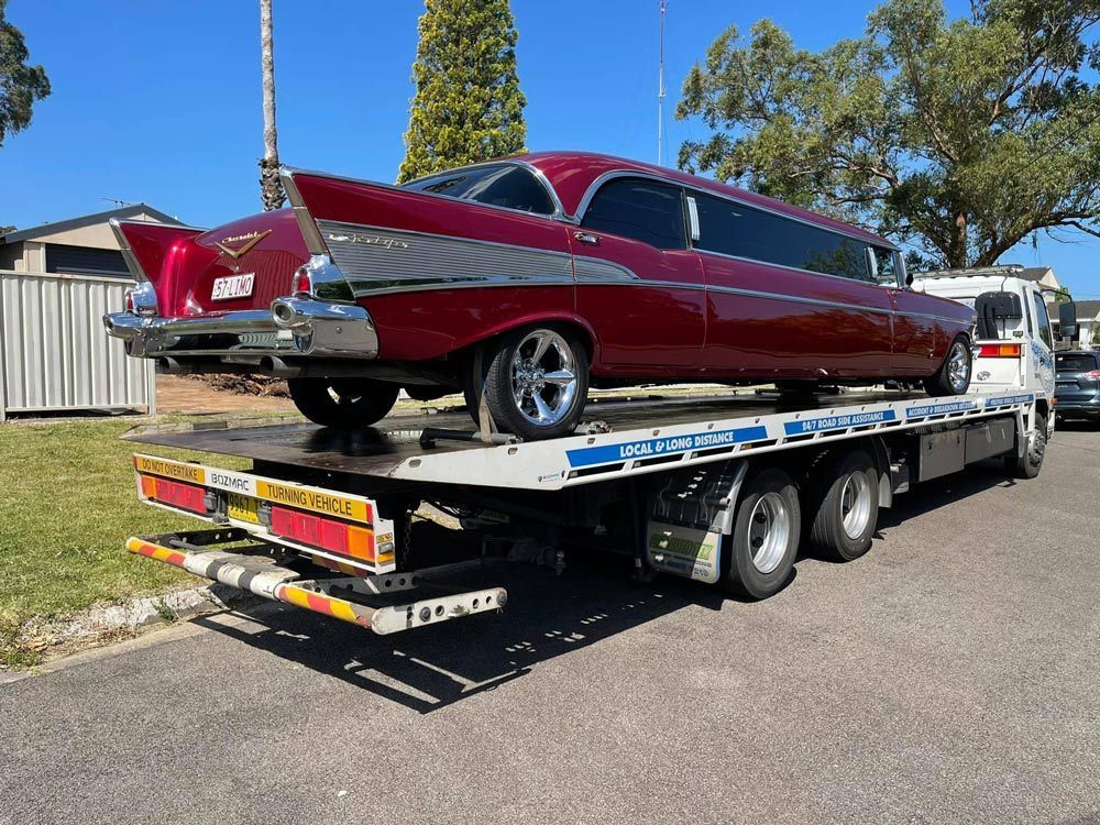 Red Chevrolet Bel Air Towed — Trade & General Towing in Sandgate, NSW