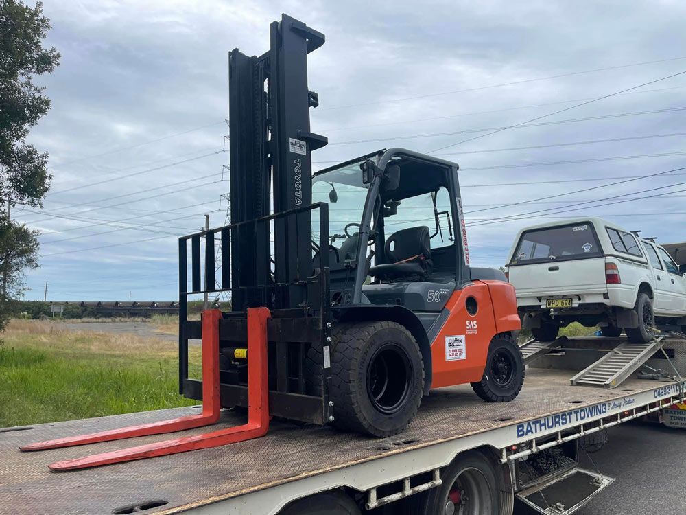 Towing Pick-up Vehicle With Forklift — Trade & General Towing in Maitland, NSW