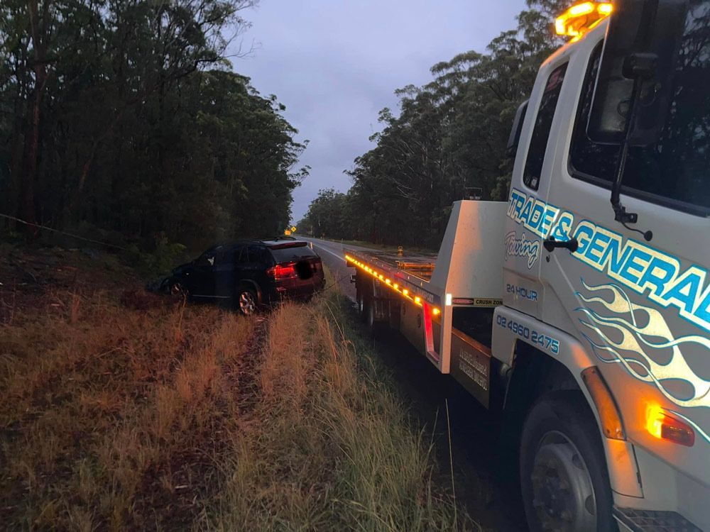 Towing The Black SUV On The Crash Site — Trade & General Towing in Wallsend, NSW