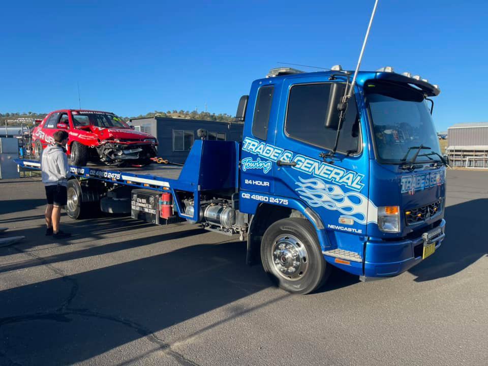 Towing The Red Racing Car Wrecked — Trade & General Towing in Wallsend, NSW