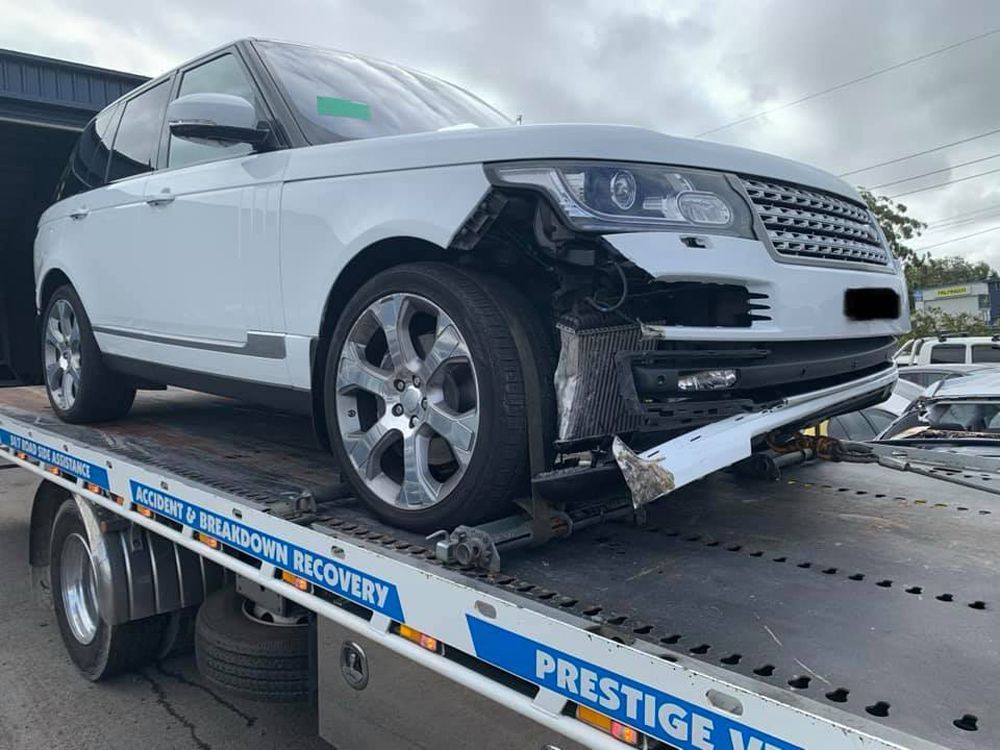 Emergency Towing White Suv After Crash