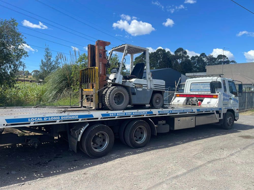 Toyota Forklift Equipment Transport — Trade & General Towing in Wallsend, NSW