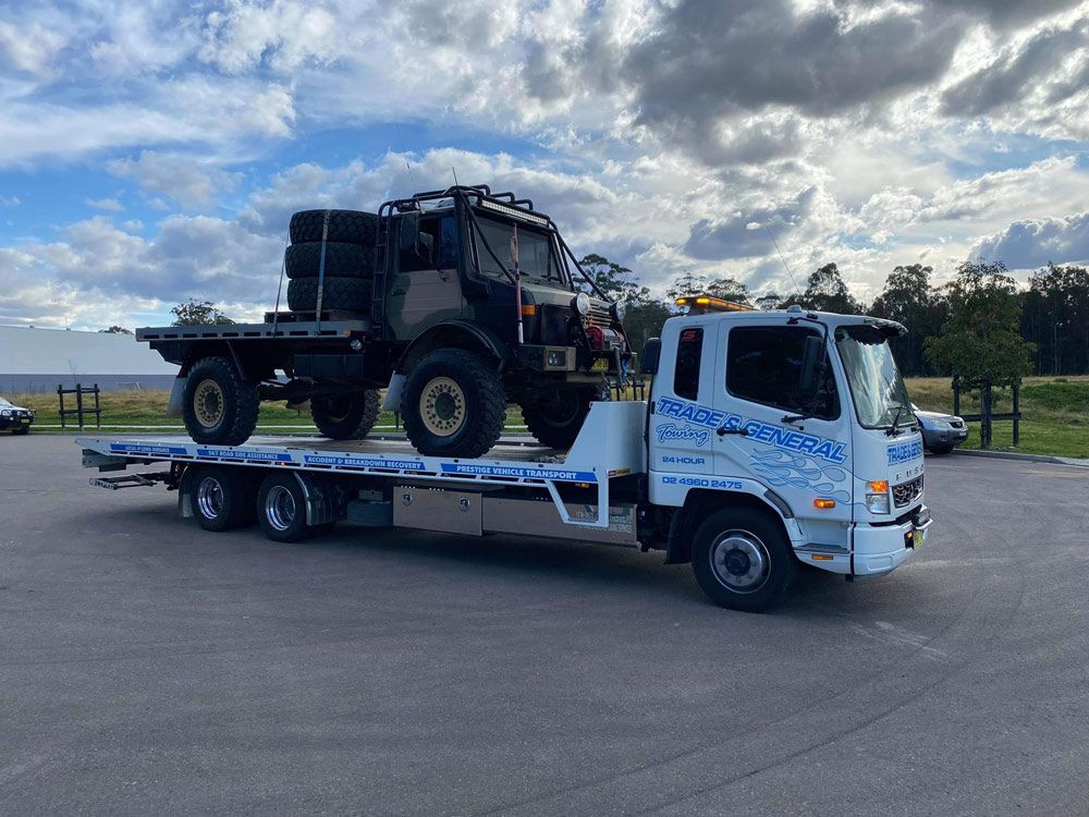 Transport 4wds Vehicle With Loading Wheels Towed — Trade & General Towing in Sandgate, NSW
