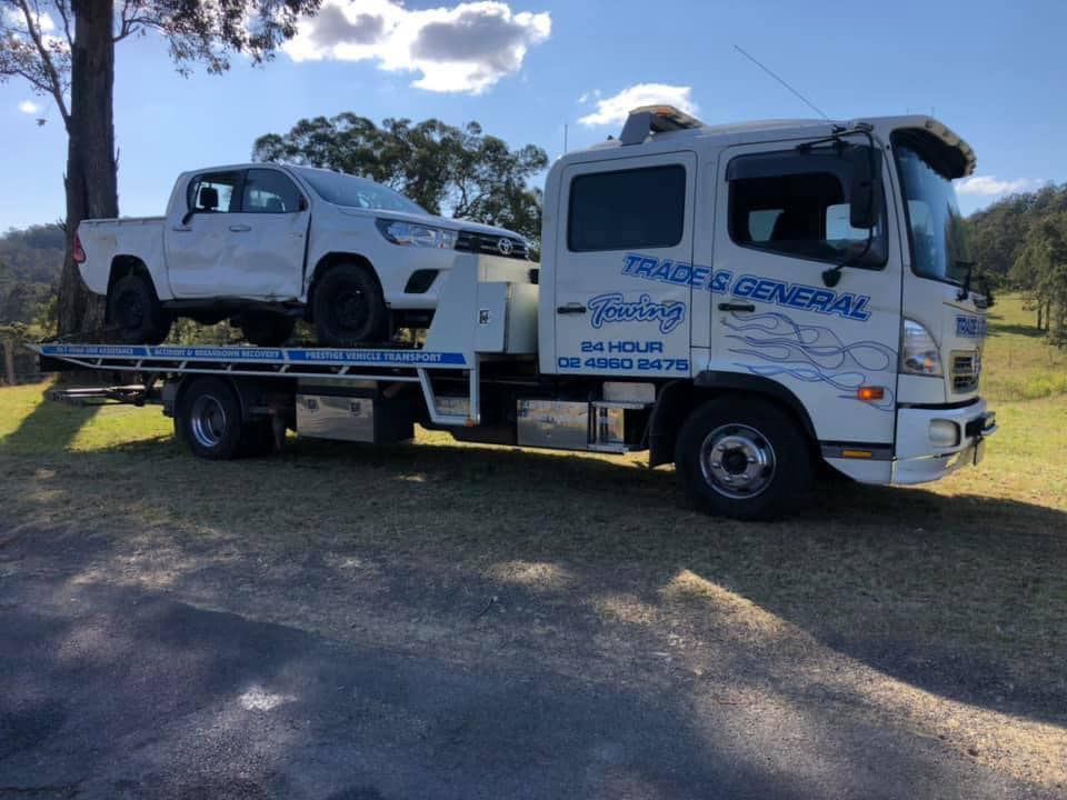 White Pick Up Towing With White Towing Truck — Trade & General Towing in Sandgate, NSW