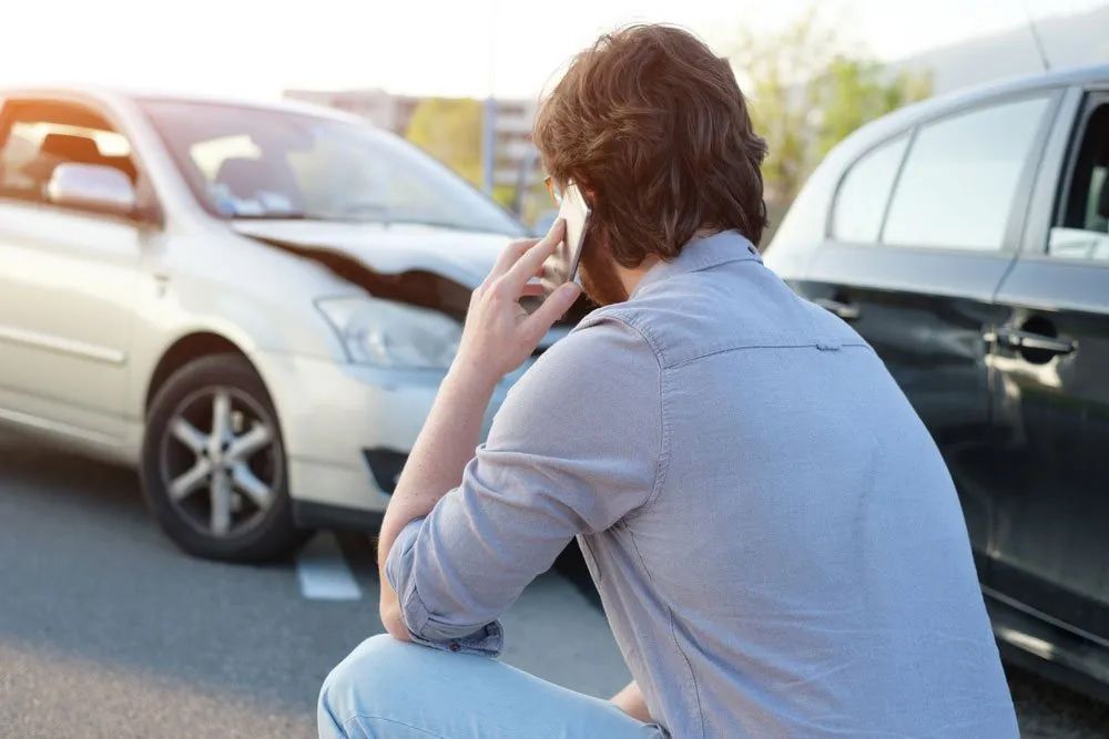 Man Calling For Help After A Car Accident — Trade & General Towing In Sandgate NSW