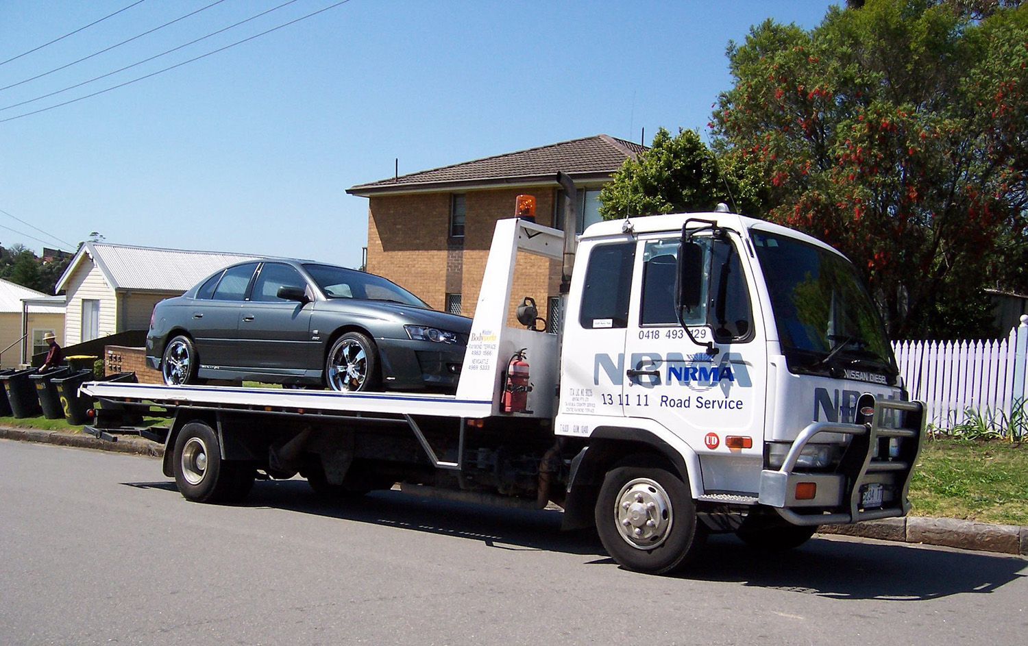 Roadside Assistance Tow Truck Transporting Car