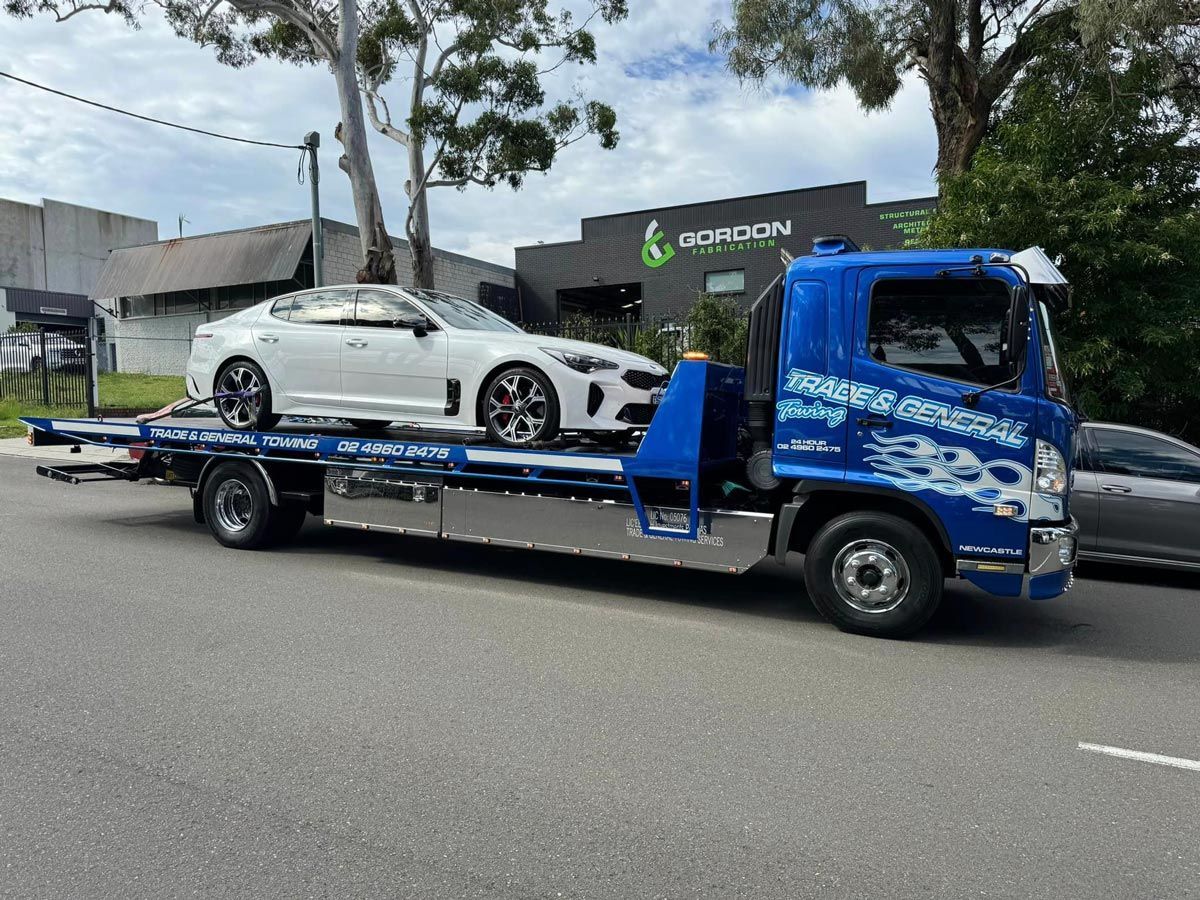 Towing A White Vehicle — Trade & General Towing in Sandgate, NSW