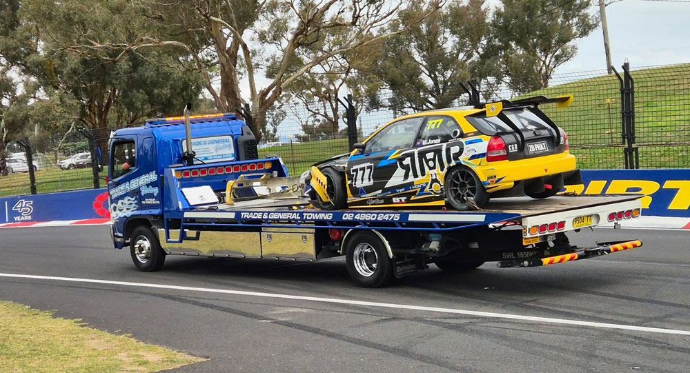 Yellow Sports Car in A Tow Truck