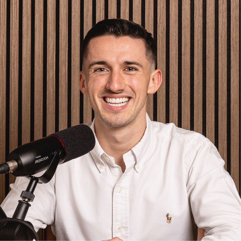 A man in a shirt smiling