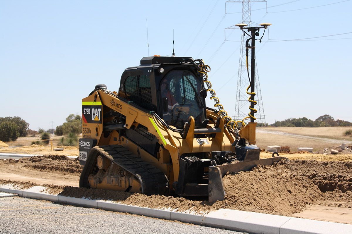 A bulldozer is moving dirt on a construction site.