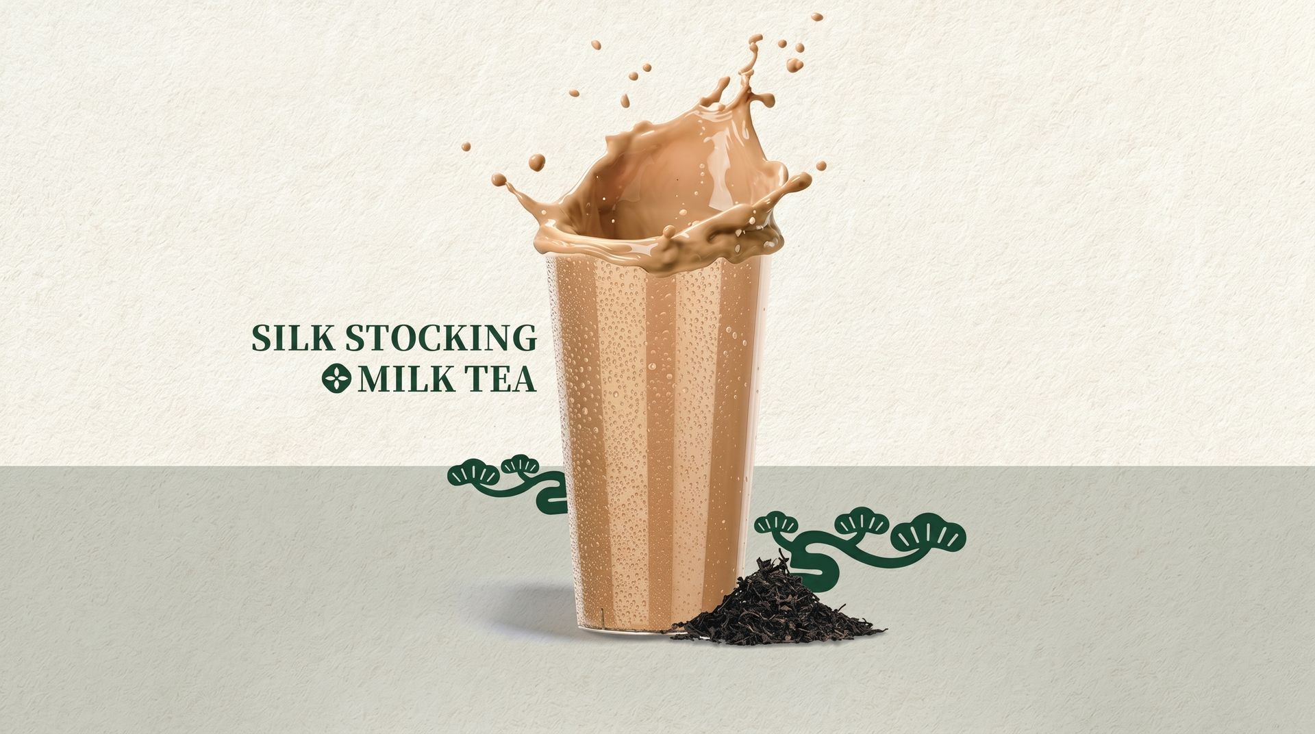 Silk stocking of milk tea pouring into a glass, with tea leaves and splashes on a light background.