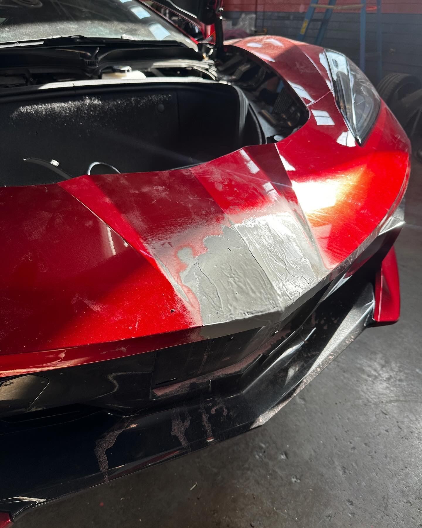 Vehicle covered for paint preparation in Phoenix collision shop