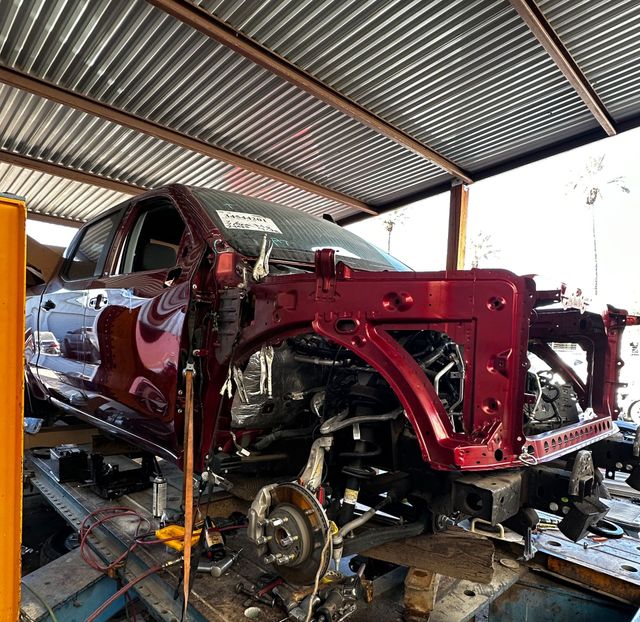 Auto body shop restoring exposed structural components