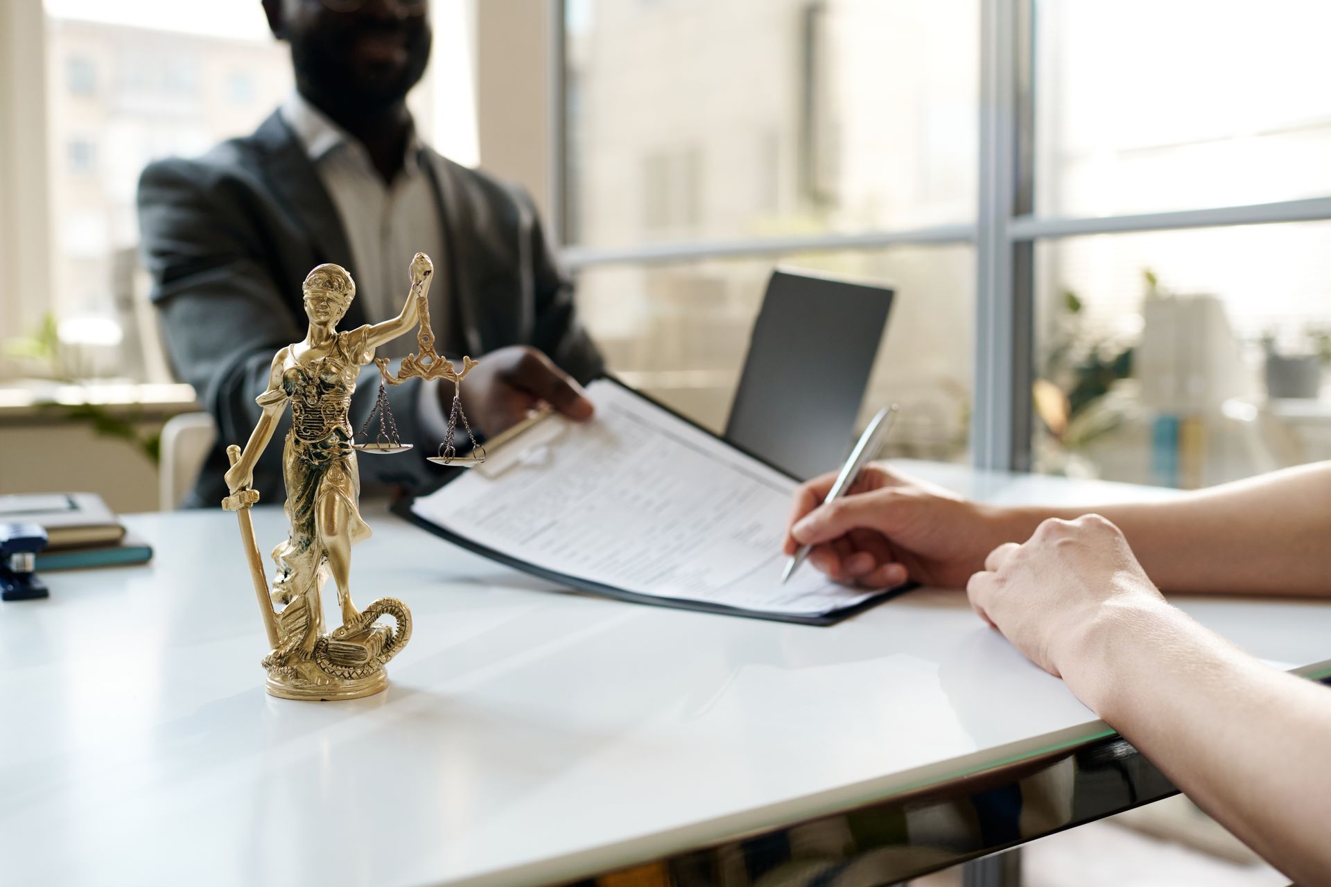 Professionals collaborate at a desk