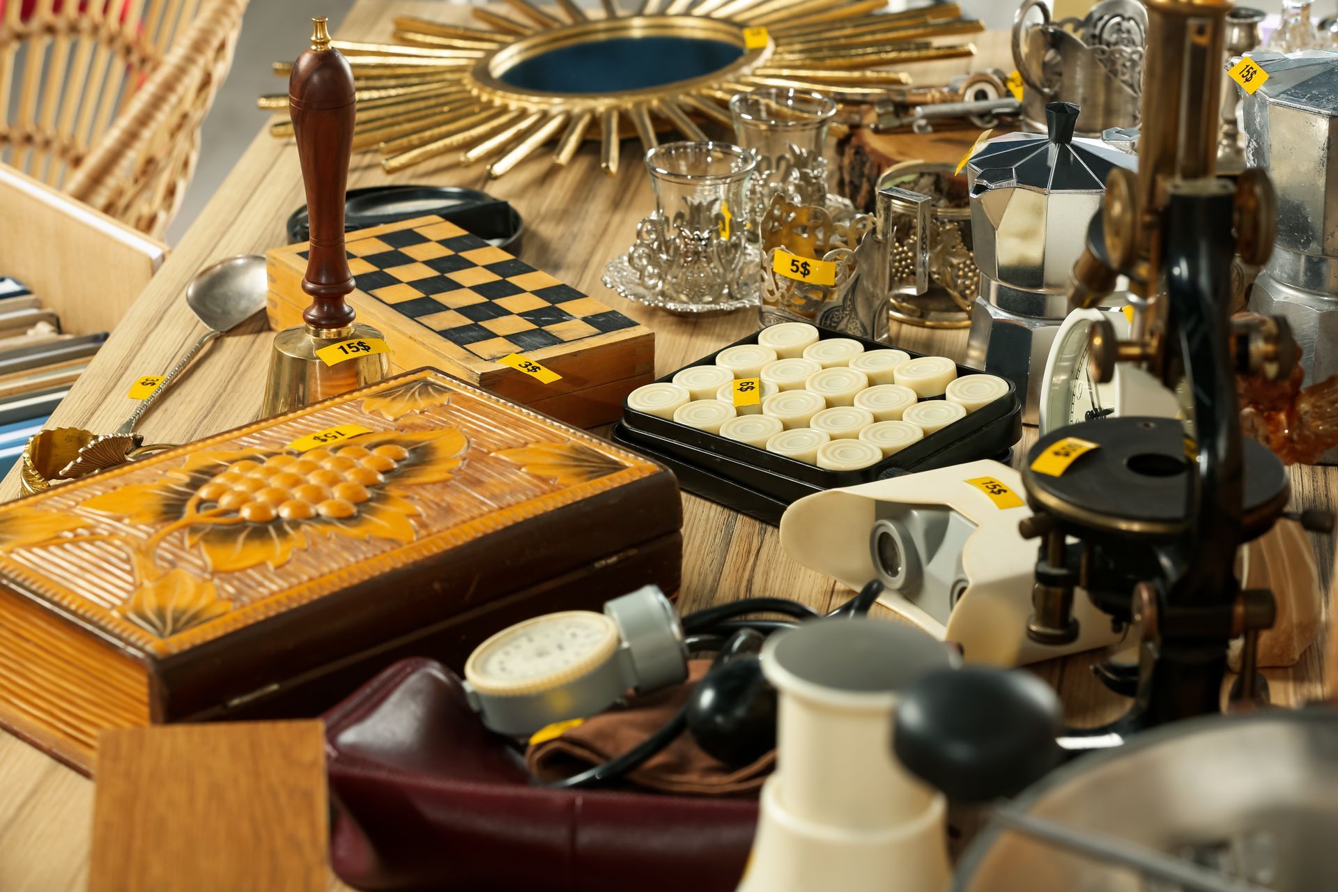 Assorted vanity and grooming items on a table, including perfume bottles, a compact, and hair accessories.