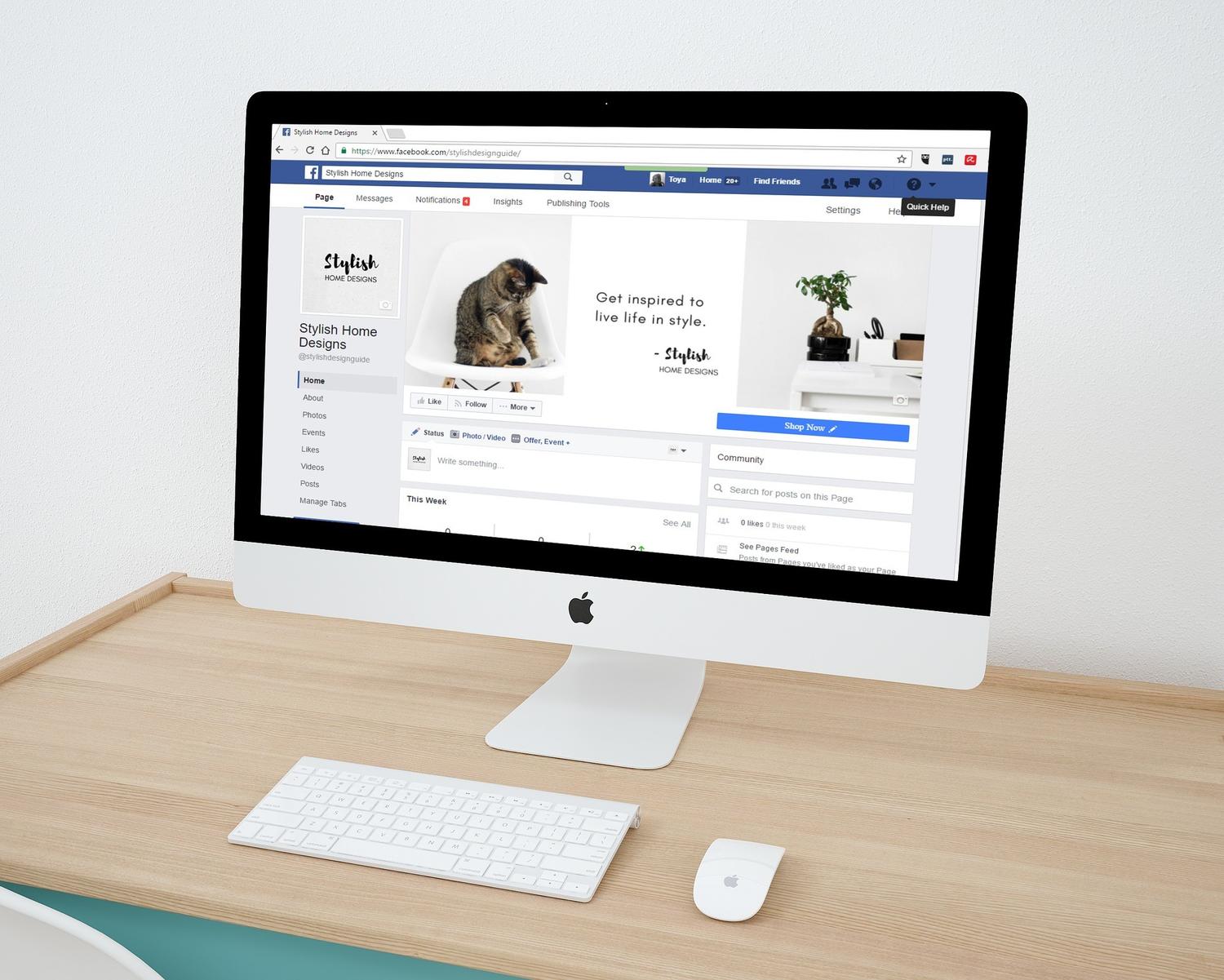 an apple computer with a facebook page open on the screen