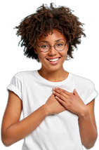 a woman wearing glasses and a white shirt is smiling and holding her hands on her chest .