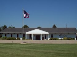 White building with American flag; 