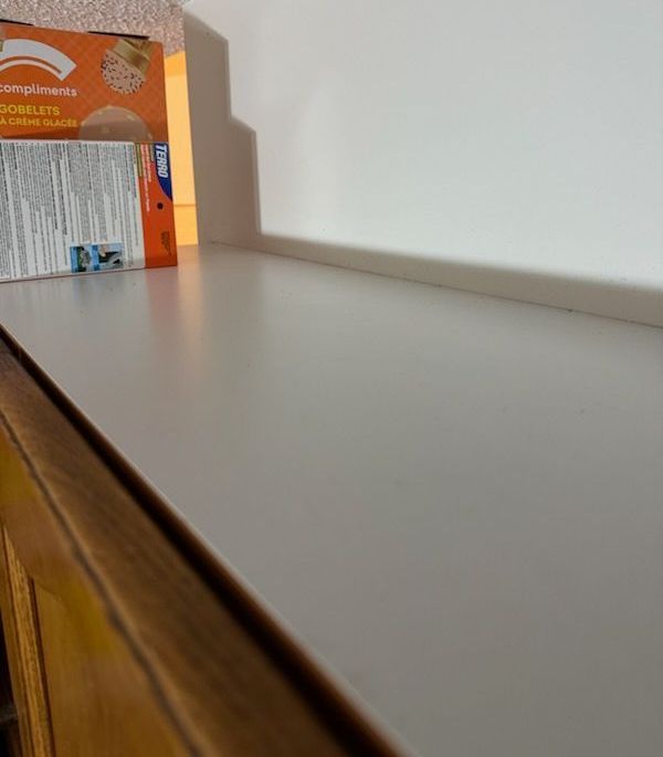 A box of cereal sits on a white counter top