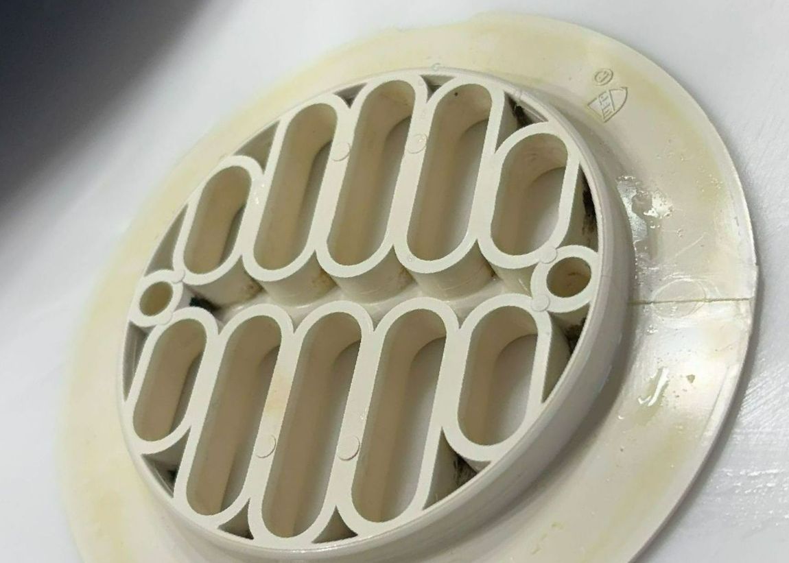 A close up of a white circle with the letter o on it