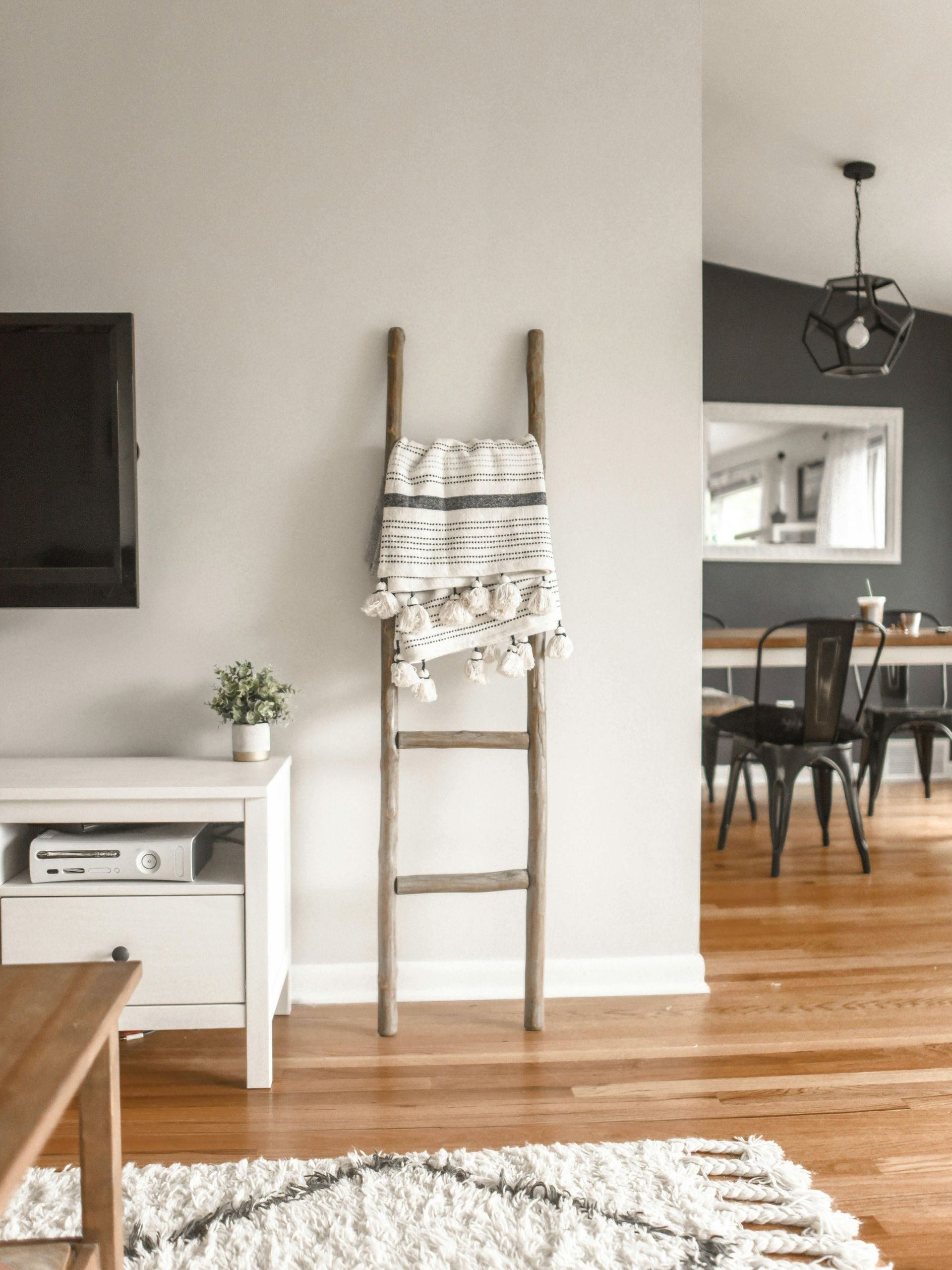 A ladder with a blanket on it in a living room