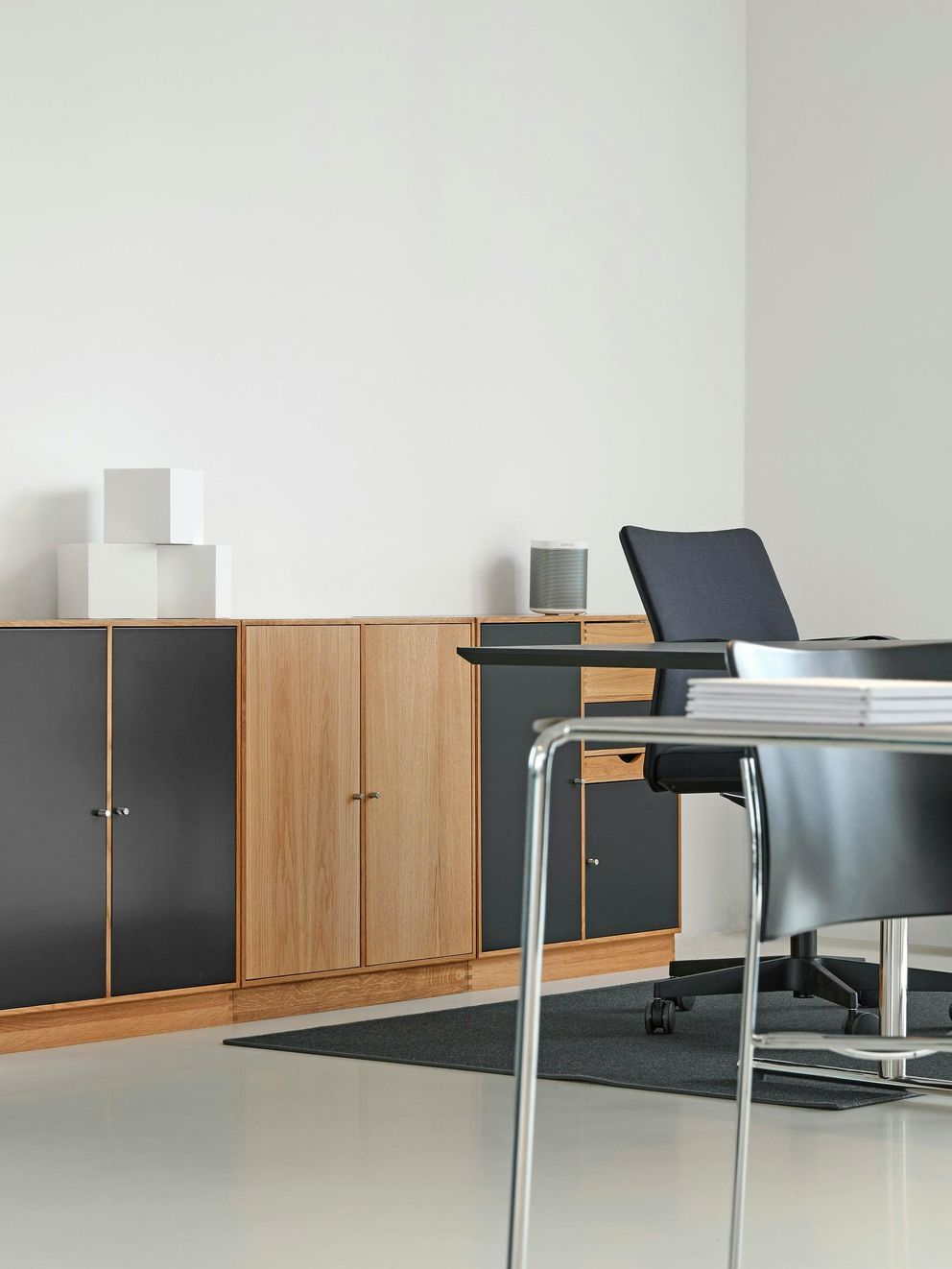 There is a desk and chair in the room.