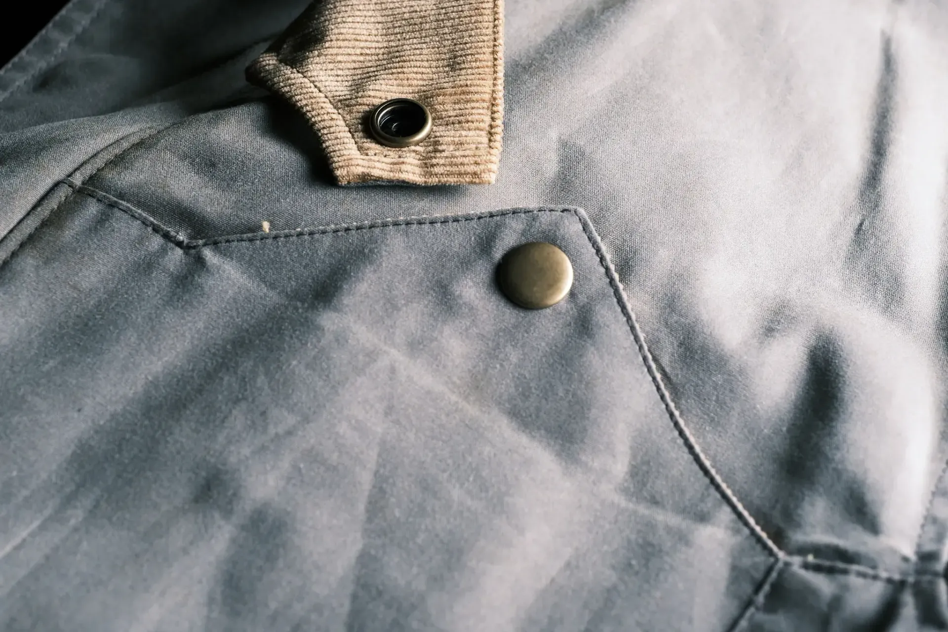 A close up of a button on a piece of clothing