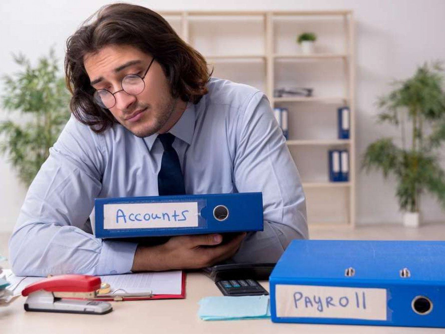 Man Holding Accounts Document
