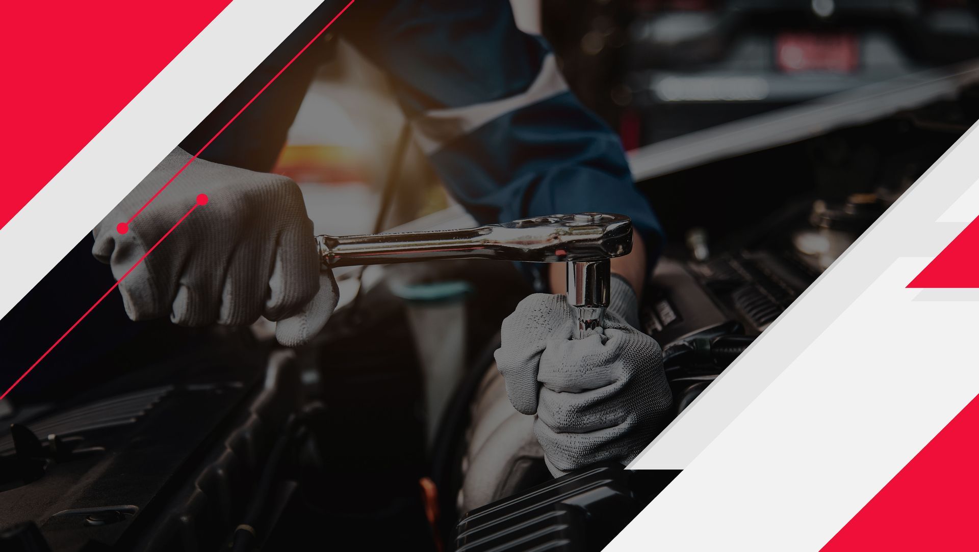 A man is working on a car with a wrench.