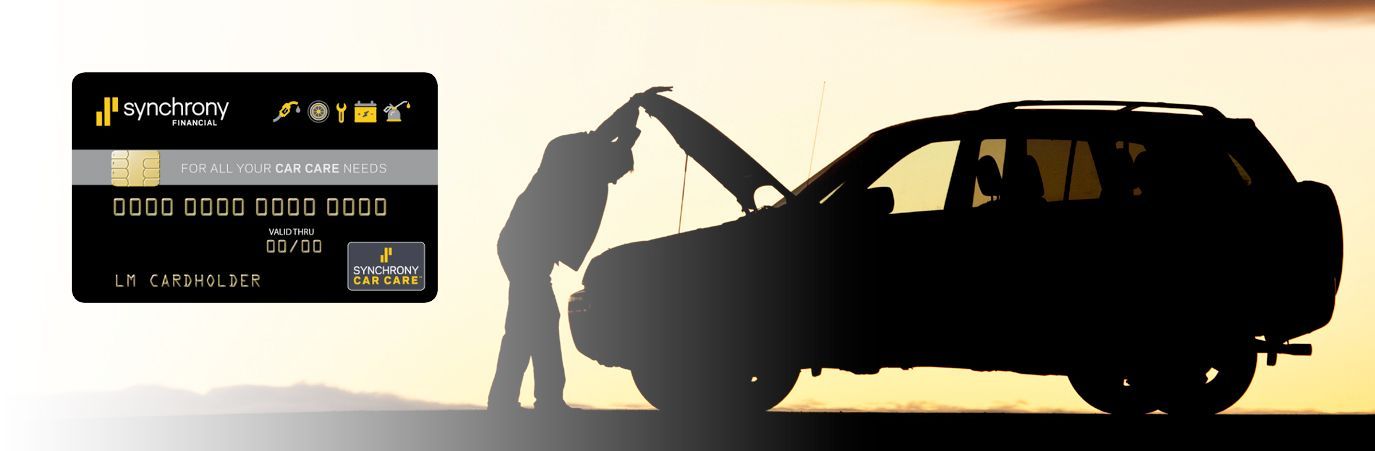 A man is opening the door of a car next to a credit card