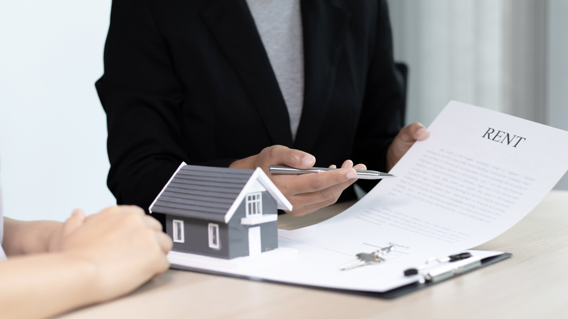 Landelord and tenant signing a rental agreement