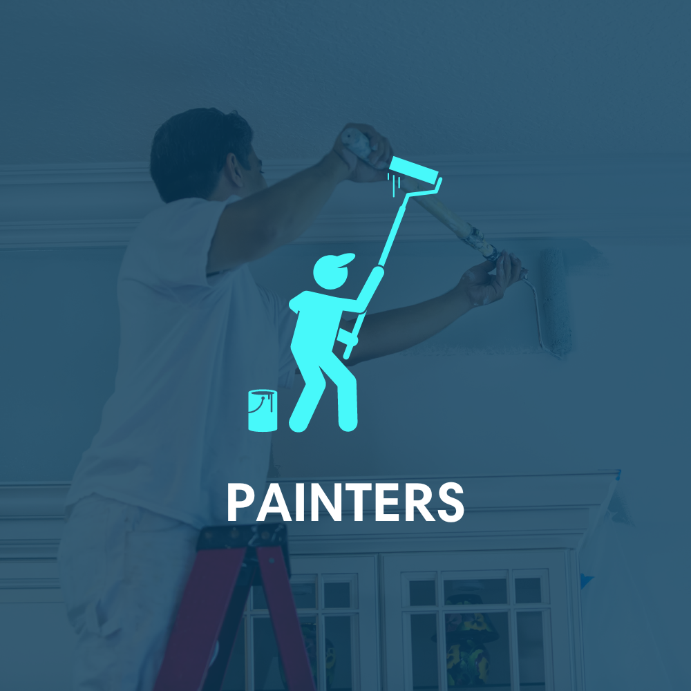 A man is standing on a ladder painting a wall.