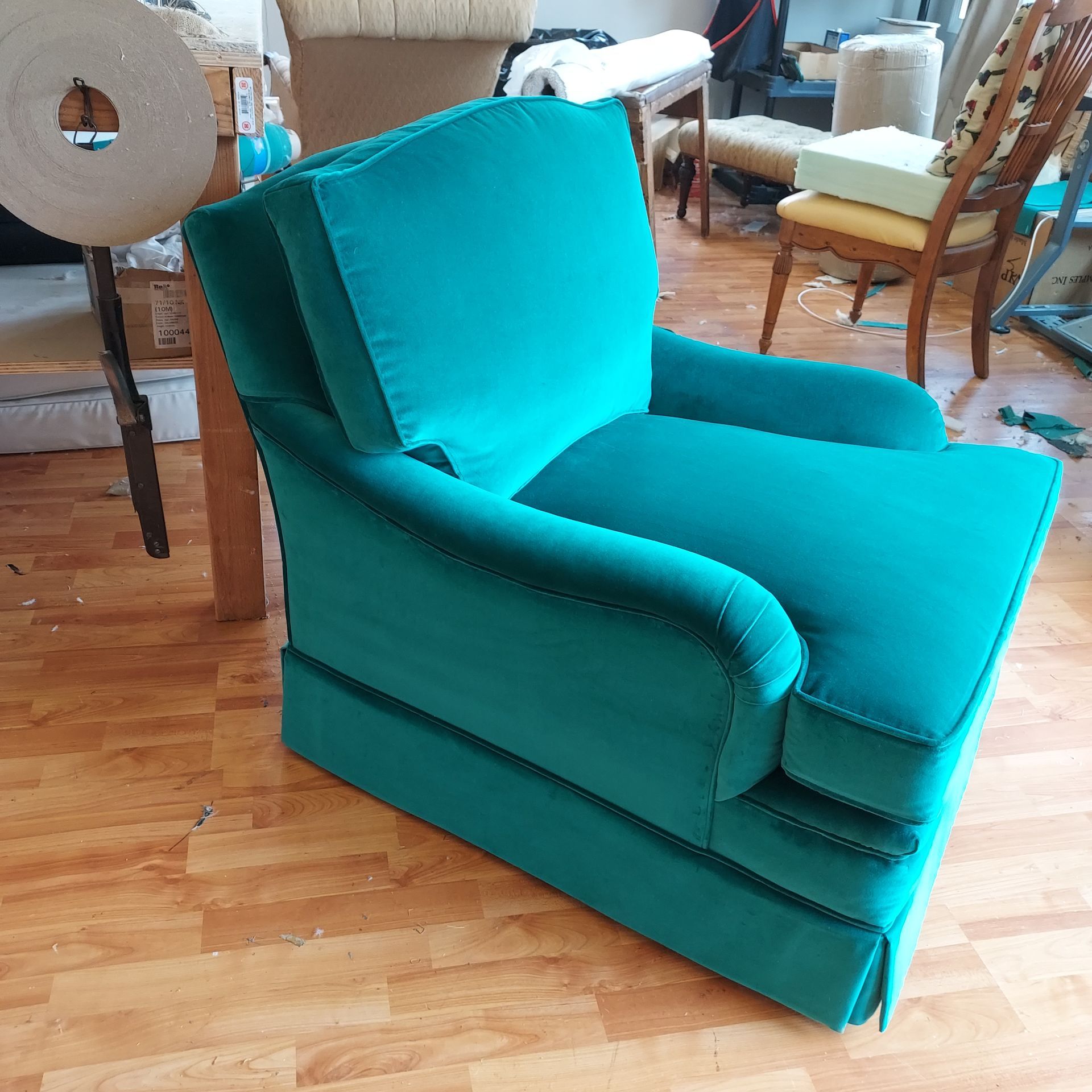 A rocking chair is sitting on a rug in a living room.
