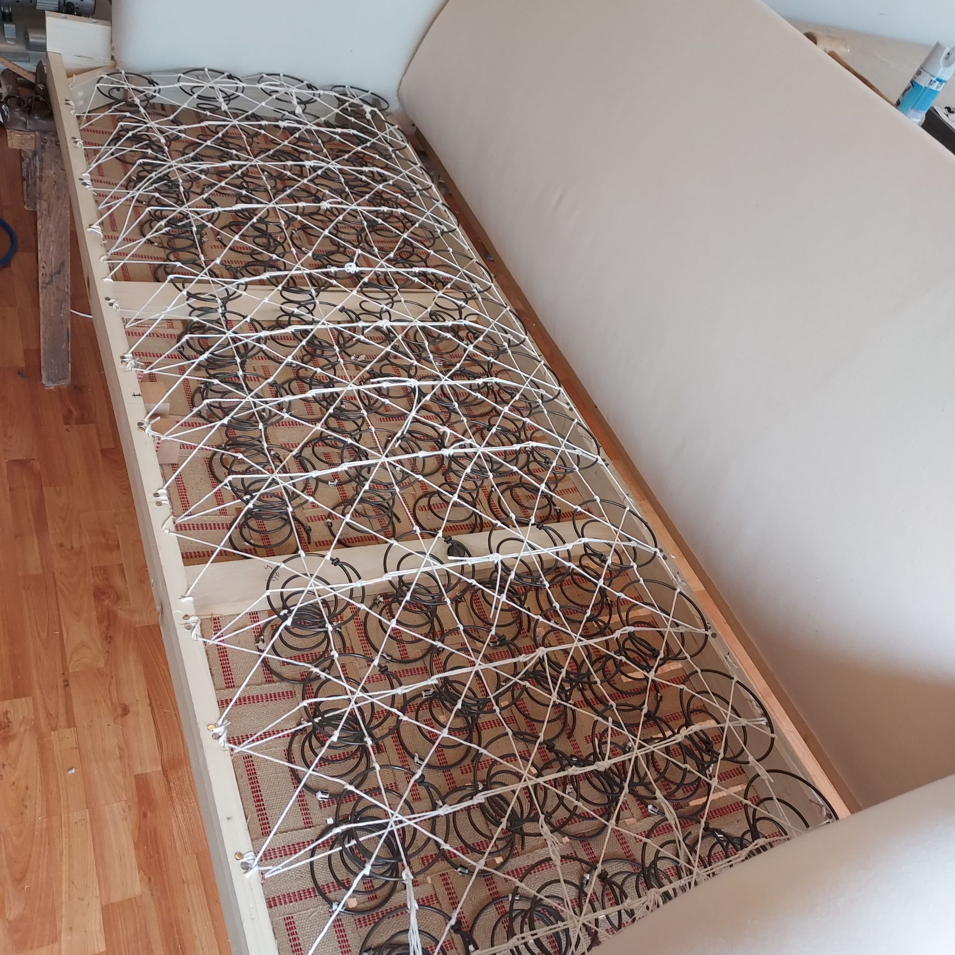 A couch with a bunch of springs on it