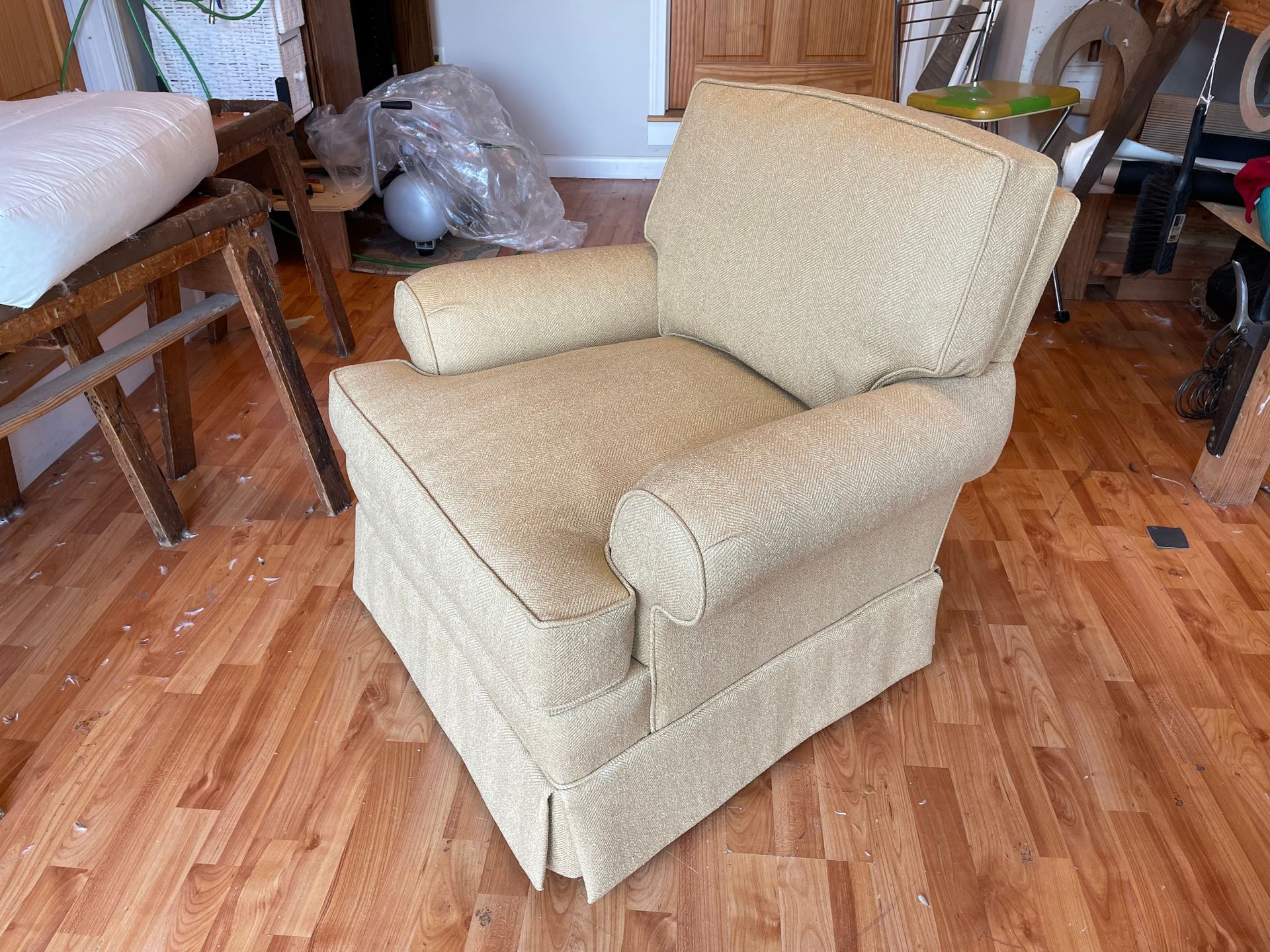A chair is sitting on a wooden floor in a room.
