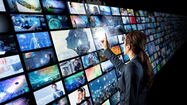 Futuristic concept of woman touching a screen
