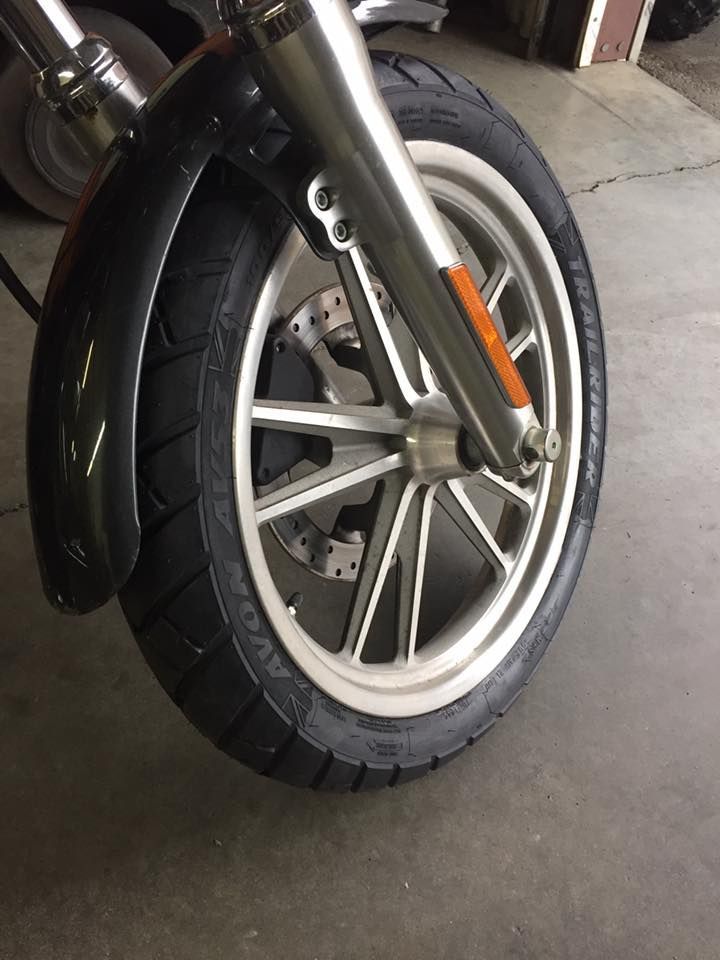 A close up of the front wheel of a motorcycle