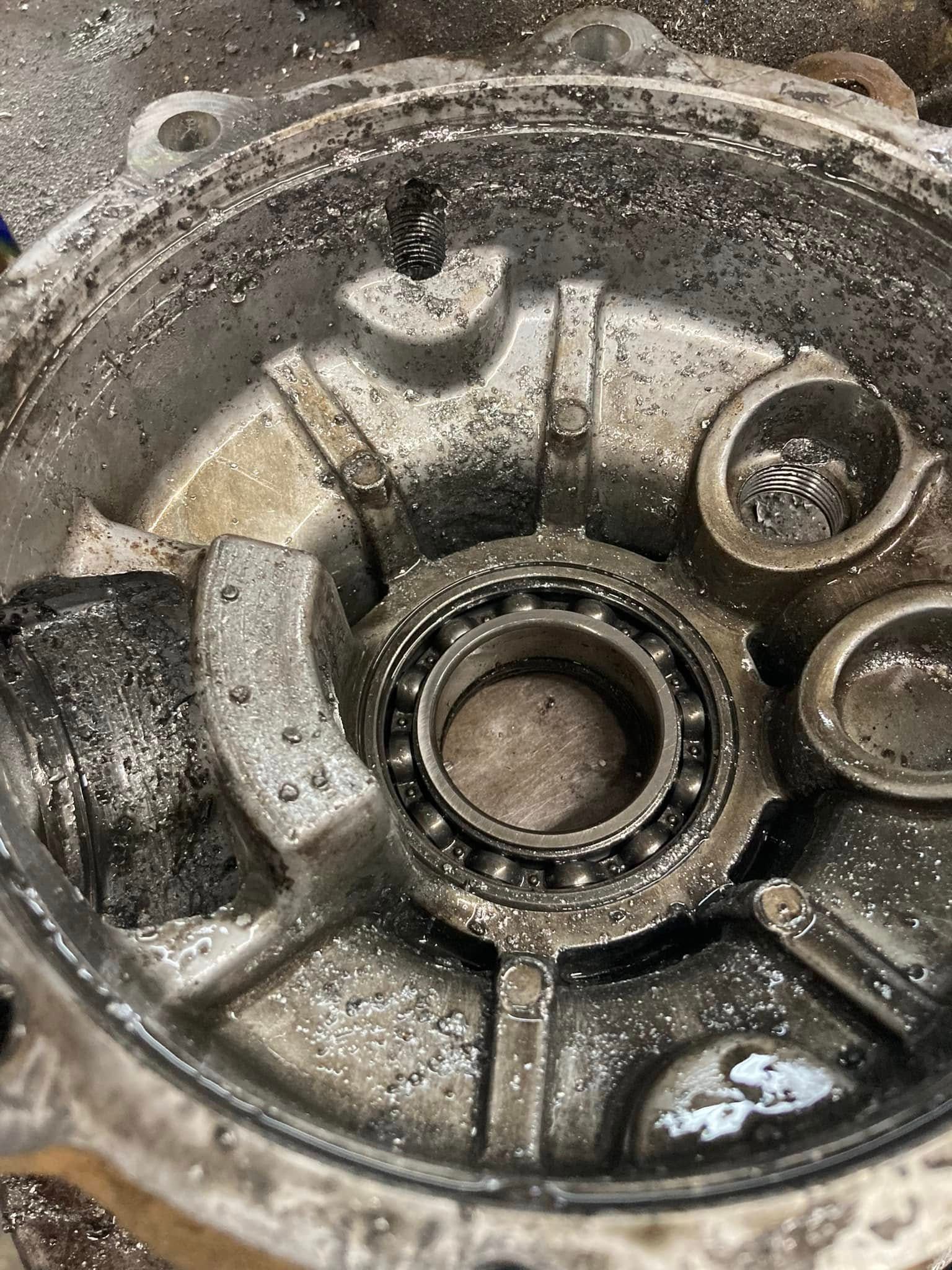 A close up of a metal object with a bearing in it.